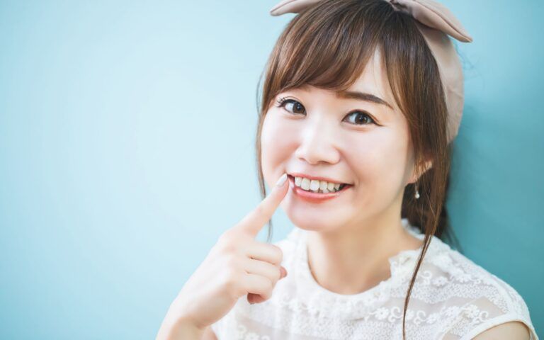 Asian Woman Smiling At New Teeth